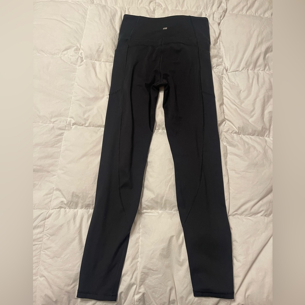 Marika brand black pocket gym leggings. Size medium